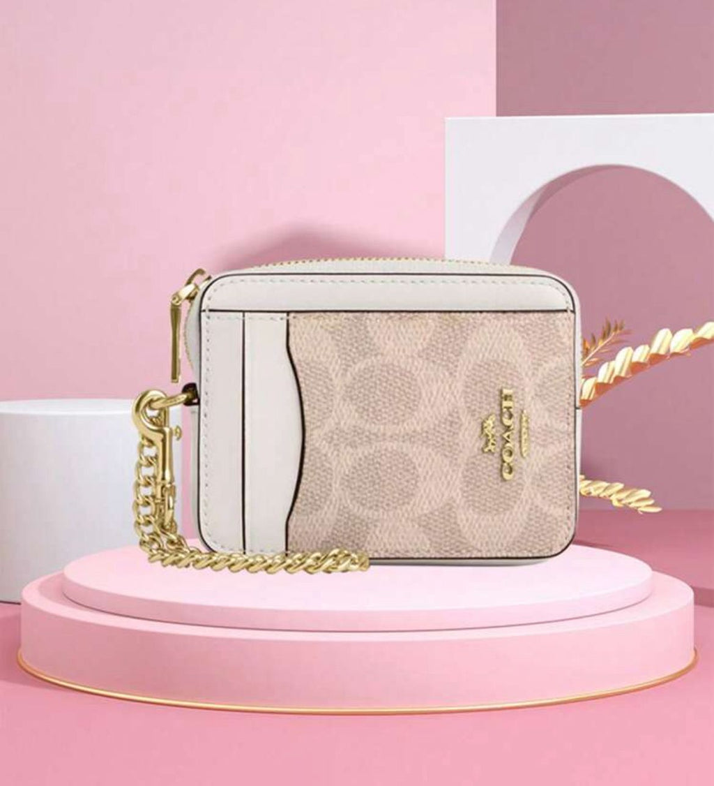 ESTUCHE DE CARTERA CON CREMALLERA MINI COACH