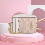 ESTUCHE DE CARTERA CON CREMALLERA MINI COACH