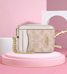 ESTUCHE DE CARTERA CON CREMALLERA MINI COACH